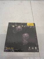 Front of sealed box showing Dudios Zeus Air wireless stereo earbuds image and branding