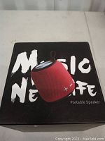 Box of M7 portable speaker with 'Music Never Die' text and image of speaker on top.
