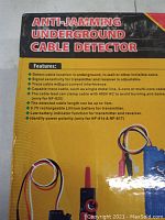 Photo of detector packaging with list of features and image of the device and cable wires.