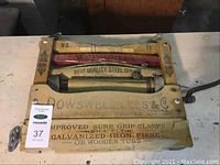 Vintage clothes wringer showing full front view with brand name and instructions.