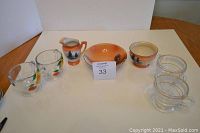 Noritake ceramic cream and sugar set with matching bowl, three additional clear glass cream and sugar sets including hand-painted and frosted banded pieces.