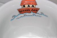 Close-up photo of the inside of the Noah's Ark bowl showing the illustration of the ark and waves.