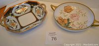 Photo showing two Nippon hand painted bowls: one round with pink and orange flowers and gilt trim, one octagonal with blue and floral pattern and gilt trim