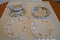 Four dishware items include a Spode Romany pattern gravy boat with underplate, a Spode Romany bowl, and two Royal Albert Peach Rose salad plates, shown on a table.