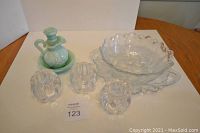 Full lot image showing all items on table: blue Avon pitcher and bowl, clear Indiana Glass bowl and underplate, three Orrefors candle holders.