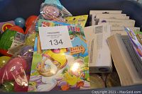 Photo showing an Easter Activity Pad, additional eggs, decorating kits, and wind-up toys.