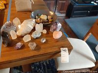 Table layout of clear and colored crystal specimens, including cluster and points