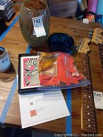 Overall lot showing framed scarf, loose scarf in protective bag, blue bowl and handblown vase