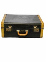 Top view of vintage Dominion Luggage suitcase showing black exterior, yellow edge trim, leather handle, and two metal latches