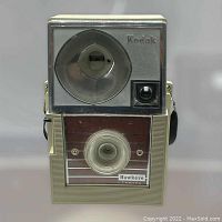 Front view of vintage Kodak Flashfun Hawkeye camera showing rotary flash reflector, viewfinder, and branding.