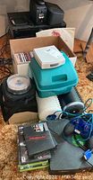 Photo showing JVC receiver, JVC CD player, speakers, boxed and spindle CD collection, and Nintendo game cases with accessories