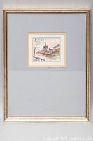 Full view of the framed watercolour of Notre Dame de Paris with a silver-toned frame and wide mat surrounding the artwork.