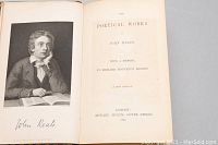 Frontispiece portrait and title page of the book The Poetical Works of John Keats, showing author name, publisher Edward Moxon, London 1854 edition.