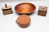 Overview of four items: wooden salad bowl, butter press, carved wooden box, round leather box