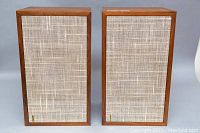 Front view of both speakers with fabric grills in place