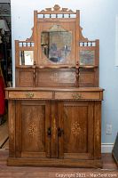 Full front view showing mirrors, drawers and lower doors