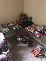 Overview of multiple vintage games displayed on tables including Trivial Pursuit, Connect 4, Chinese Checkers, and Upwords.