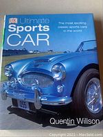 Front cover of the book showing a blue classic sports car and the title 'Ultimate Sports Car' by Quentin Willson.