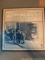 Vinyl album cover for Workingman's Dead by Grateful Dead showing full front art and title.