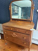 Full dresser with attached cheval mirror showing overall condition and design.