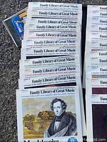 Top view of 22 vinyl records from Family Library of Great Music series with visible titles on covers