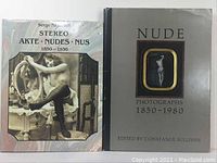 Photo of front covers of two vintage nude art photography books, showing cover illustrations and titles.