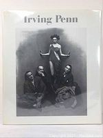 Front cover of the Irving Penn book with black and white photo of four figures, three seated men and one standing woman.