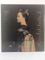Front view of the book cover showing a side profile of a Japanese woman in traditional attire.