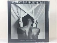 Front cover of dust jacket showing black-and-white photograph of nude figure and title text