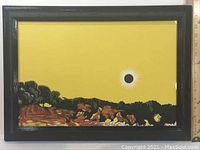 Front view of the framed silkscreen poster showing the yellow background with landscape and sunburst design.