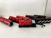 Overview of CP Rail train cars including crane car, locomotives, boxcars and shell halves