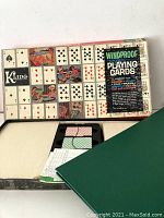 Box of vintage Kling magnetic playing cards with visible cards inside and exterior showing.