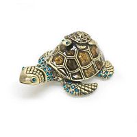 Front angle view of the enameled metal mother and baby sea turtle ring box with blue rhinestones on shell, flippers, and eyes.