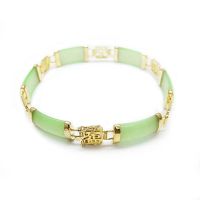 Top-down view of green jade and gold plated link bracelet showing link uniformity and clasp design