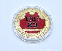 Front side of coin showing red Chicago Bulls jersey #23 with text 'Most Valuable Player', 'Basketball Legend', and 'Limited Edition .999'