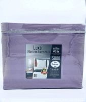 Front view of purple packaged Luxe Maison Luxueuse 4 piece microfibre double bed sheet set, showing clear zippered bag packaging.