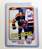 Front photo of 1981 Topps Wayne Gretzky hockey card showing player in Edmonton Oilers uniform with Topps logo.