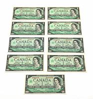 Front side of nine Canadian $1 bills showing Queen Elizabeth II portraits and serial numbers.