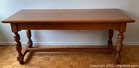 Front view of the full table showing structure and finish