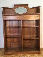 Full front view showing entire oak bookshelf, mirror, drawers and shelves