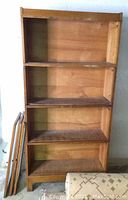 Full view of the barrister bookcase without doors attached, showing four shelved compartments and wooden finish.