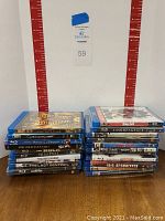 Two stacks of BluRay movies shown from the front, titles visible on spines including The Curse of King Tut's Tomb, Casino Royale, and others