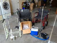 Wide view of all medical equipment including wheelchairs, walkers, cane, cooler box and assistive devices.