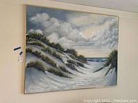 Photo of full canvas wall art showing the beach dune scene with ocean horizon and cloudy sky.