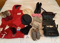 Full lot spread showing red HBC jacket, two Tilley hats, various shoes, gloves, belts, handbags and mittens.