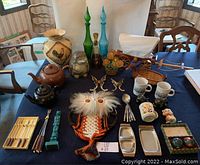 Full view of lot on table showing all items from various angles with different lighting