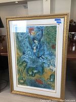 Full view of framed lithograph showing overall condition and framing.