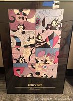 Frontal view of the framed Felix Miro movie poster with stylized cartoon cats and abstract shapes in pastel colors.