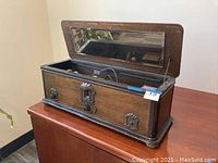 Full view of the RCA Radiola 60 antique radio wooden cabinet with lid open showing inside components and glass window in lid.