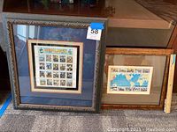 Photo displaying two framed stamp collections titled Civil War and 1945 Victory at Last, showing overall presentation and framing.